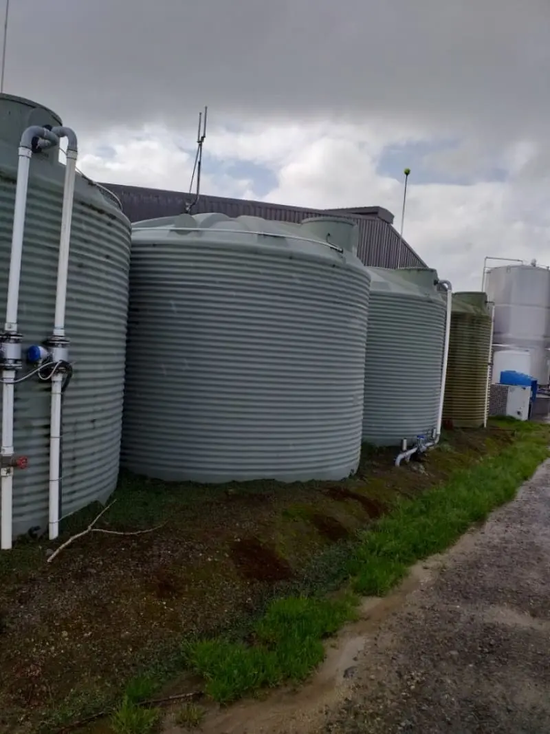 Large water storage tanks with connected piping for rural water supply management