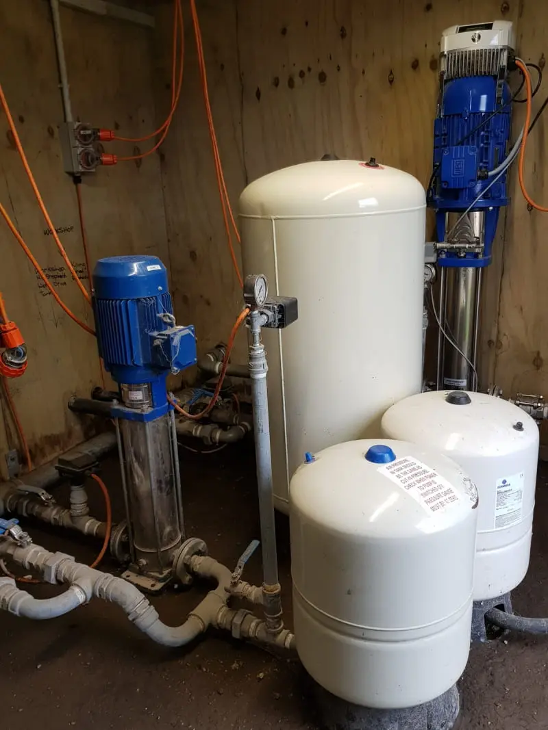 Water Services NZ pressure tank system with pumps and connected piping for rural water supply management.